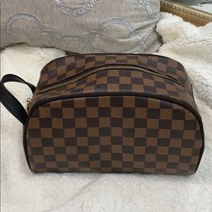 Brown checkered toiletry bag